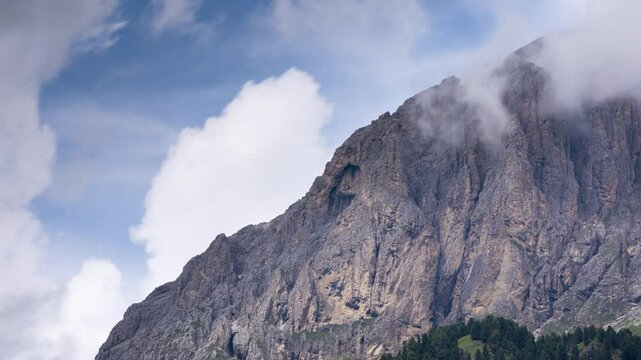 A view of the Dolomites from Campitello di Fassa into Val di Fassa - Timelapse