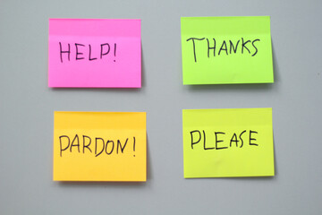 Colorful Sticky Notes with Words of Help Thanks Pardon Please on Gray Background