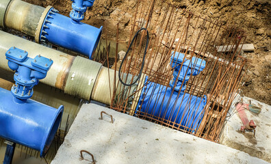 New fiber glass water pipeline in trench. Replacement of old rusty tubes by new one