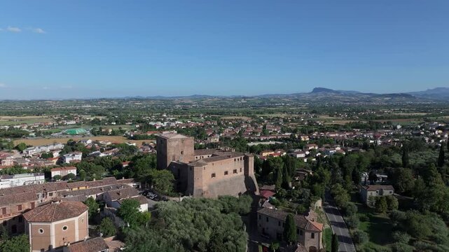 rising aerial of the Malatestiano castle in Santarcangelo di Romagna, Italian city famous for parmigiano reggiano cheese and other culinary delights