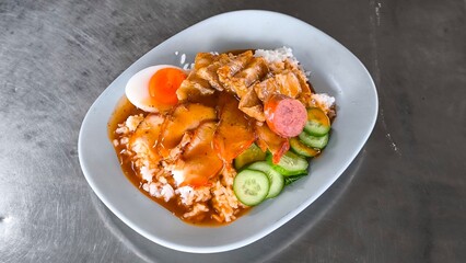 Red pork and crispy pork on rice, food in Thailand