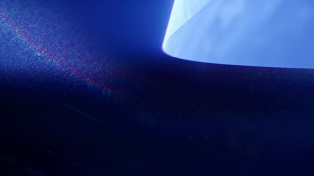 Temporal aliasing blue laser slow spiral effect in smoke creates an eerie ominous science fiction high-tech look for scifi motion graphic asset. Streaks of light move upwards with suspense, flare.