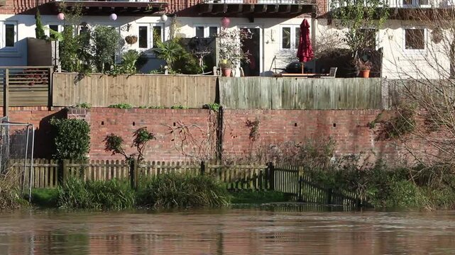 The River Severn in flood near houses at Bewdley, Worcestershire after Storm Bert. November 2024. UK