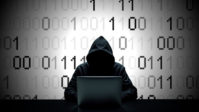 Hacker working on laptop on abstract digital background