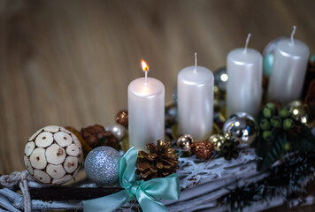 The symbol of Advent is an Advent wreath with four candles. The first lit candle on the Advent wreath means HOPE.