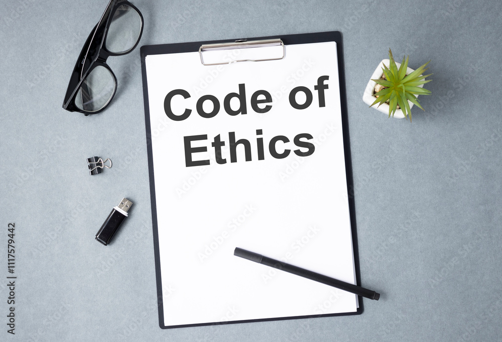 Poster code of ethics text on notebook. concept of ethical integrity, value and ethics.