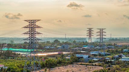 A shot of high voltage electric transmission tower, also known as electricity pylon, from windfarm in Tan Thanh, Go Cong, Vietnam.