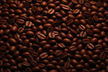 Obraz premium Dense textured pile coffee beans dark brown shape roast