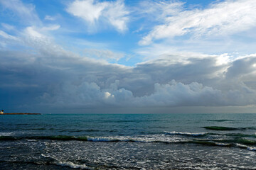 Storm wind at sea. Waves and thunderclouds. Horizon. The elements in all their glory.	