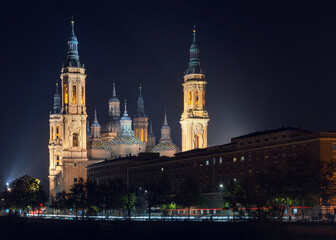 Illuminated Basilica of Our Lady of the Pillar at Night in Zaragoza