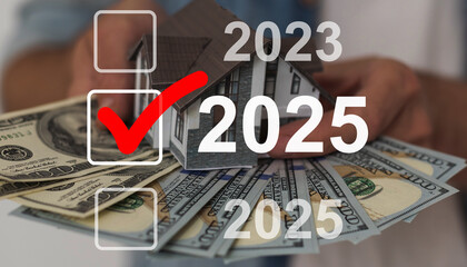 Businessman pointing to digital 2025 on virtual screen. Countdown to 2025 concept. Space for text....