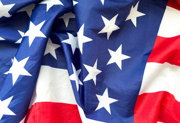 Close up of ruffled American flag. Satin texture curved flag of USA. Memorial Day or 4th of July....