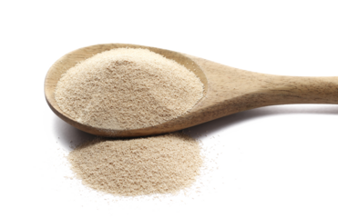 Dry yeast in wooden spoon isolated on white background, side view
