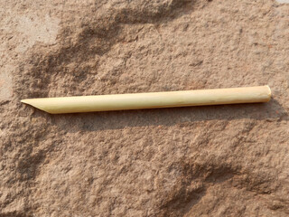 Traditional calligraphy pencils isolated on stone background. Ottoman, Arabic, Persian and orient culture. Calligraphy, arts, lettering, wooden concepts. Horizontal macro shot. Indian Mughal dynasty