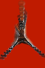Basketball player leaping with arms extended, creating star-like shape. Stroboscopic effect...