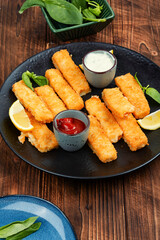 Delicious fish fingers or fish nuggets.