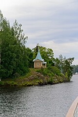  Valaam Island, Russia, July 12, 2024. View of the Pokrovskaya Chapel on the shore.                             