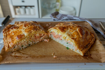 Delicious puff pastry filled with salmon, rice and egg salad 