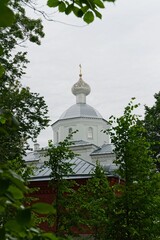 Fototapeta premium Valaam Island, Russia, July 12, 2024. The dome of the temple through the branches of trees. 