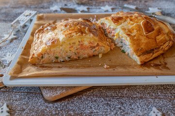 Delicious puff pastry filled with salmon, rice and egg salad 