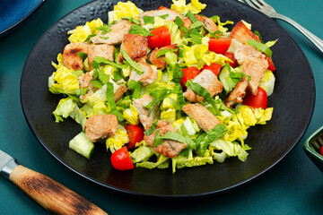 Salad with meat and fresh vegetables.