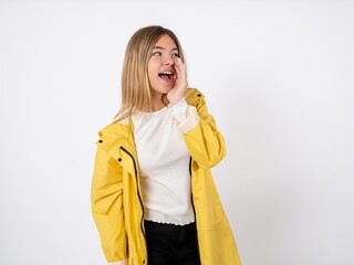 Beautiful teenager girl wearing yellow raincoat hear incredible private news impressed scream share