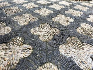Elegant Cobblestone Pathway with Unique Floral Design
