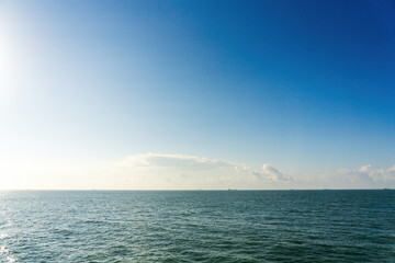Fototapeta premium Tranquil Ocean View Under a Clear Blue Sky