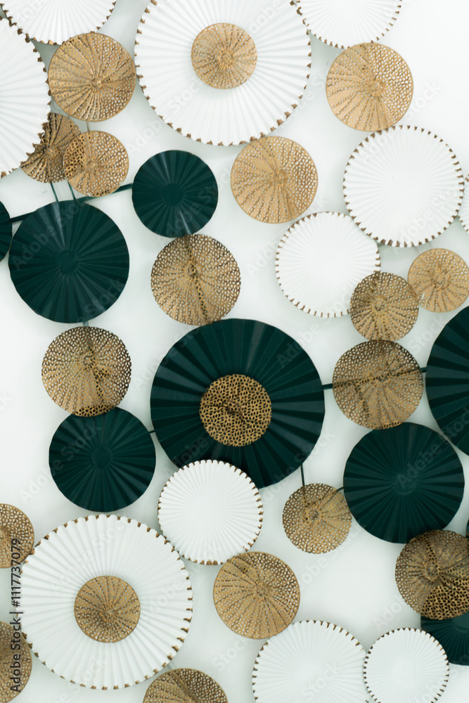 Poster close-up of a decorative wall piece. the piece is made up of a series of circular shapes, each with 