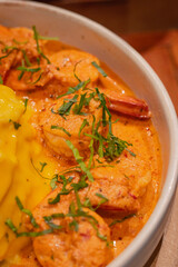 Close up, Creamy omelet with tom yum kung served with rice on dish, place on wooden board