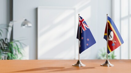FLAGS OF NEW ZEALAND AND SWAZILAND ON TABLE