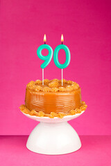 Birthday card with candle number 90 - Cake with dulce de leche frosting.