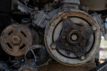 Burnt out car engine in Ukraine. after a fire or accident scene, covered with rust..