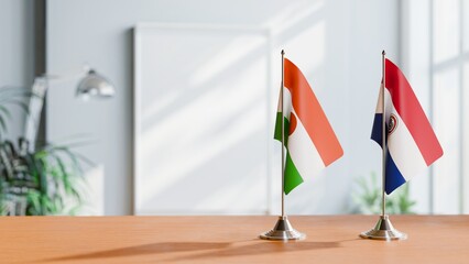 FLAGS OF NIGER AND PARAGUAY ON TABLE