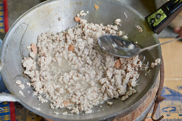 Stir-fried pork in cooking pan