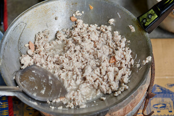 Stir-fried pork in cooking pan