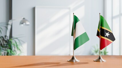 FLAGS OF NIGERIA AND SAINT KITTS ON TABLE