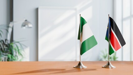 FLAGS OF NIGERIA AND SOUTH SUDAN ON TABLE