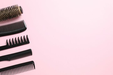 Professional combs and hairdresser tools on color background, top view