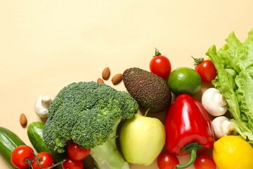 Clean healthy eating habits concept. Fruits, herbs, greens and vegetables mix, colorful juicy organic detox smoothie juice ingredients, color background. Vegan vegetarian diet food