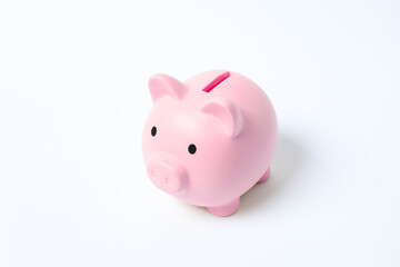Piggy coin bank on white background for money savings, financial security or personal funds concept.