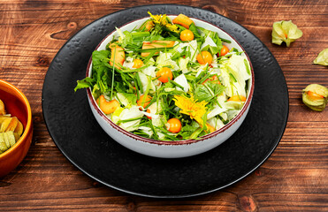 Salad with physalis and field grass