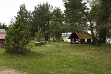 gazebo at a tourist base in the forest near the lake