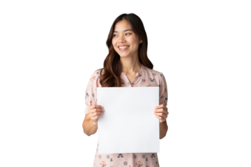 isolated portrait of a smiling young woman in a floral dress holding a blank white sheet of paper