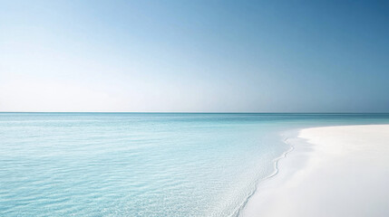 Obraz premium Pristine white sandy beach meets crystal clear turquoise waters under a serene, cloudless blue sky, exuding tranquility and natural beauty.