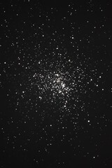 Obraz premium A black and white photograph of a star cluster