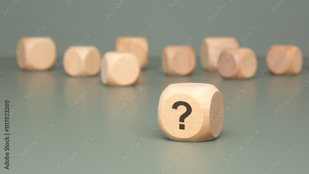 Poster intriguing wooden blocks that are beautifully displaying question marks on a gray surface