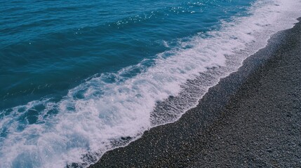 A person riding a surfboard in the ocean