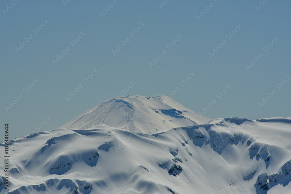 Wall mural Llaima Vulcano patagonia chile view on a blue sky day winter snow