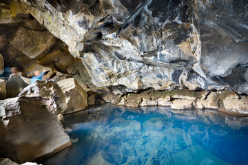 Grjótagjá - small lava cave located near lake Mývatn in north Iceland, famous for beautiful geothermal hot spring in its depths